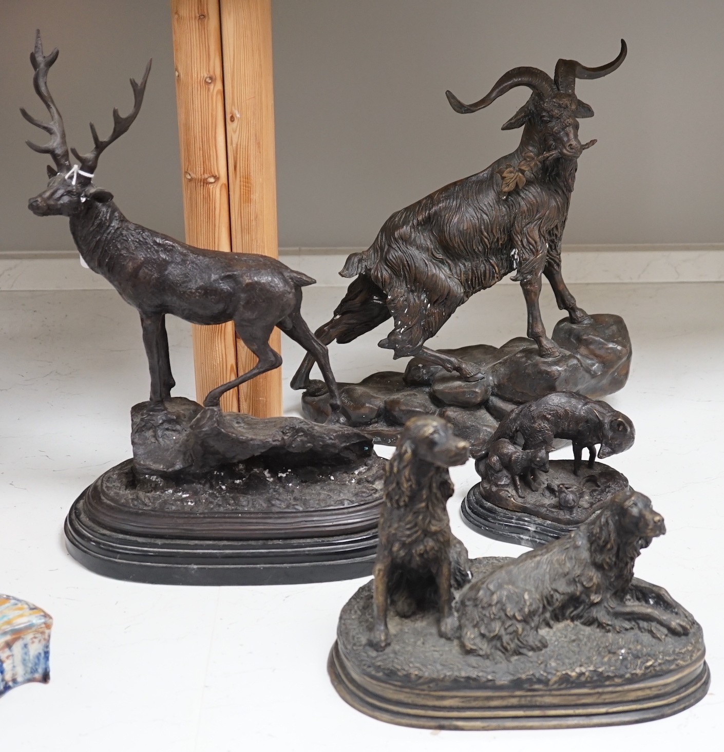 Four bronze animal groups, three foxes, a ram, a stag and two dogs, tallest stag 40.5 cms high